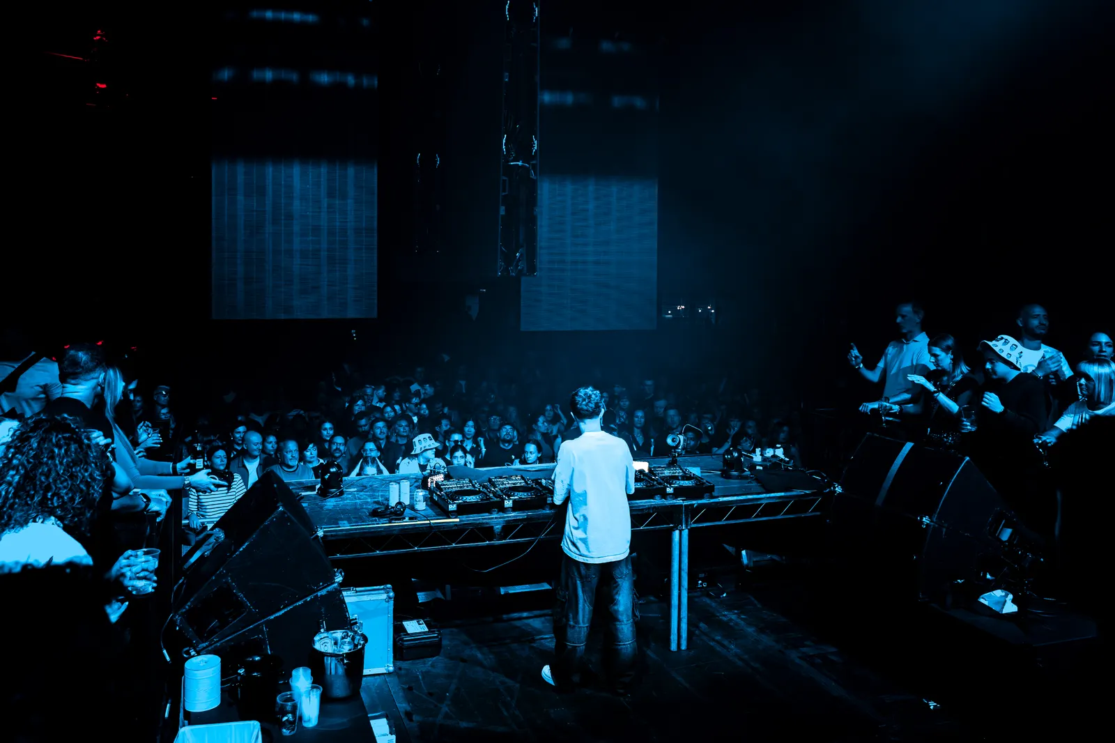 SUBSHIFT playing to a crowd under blue lights