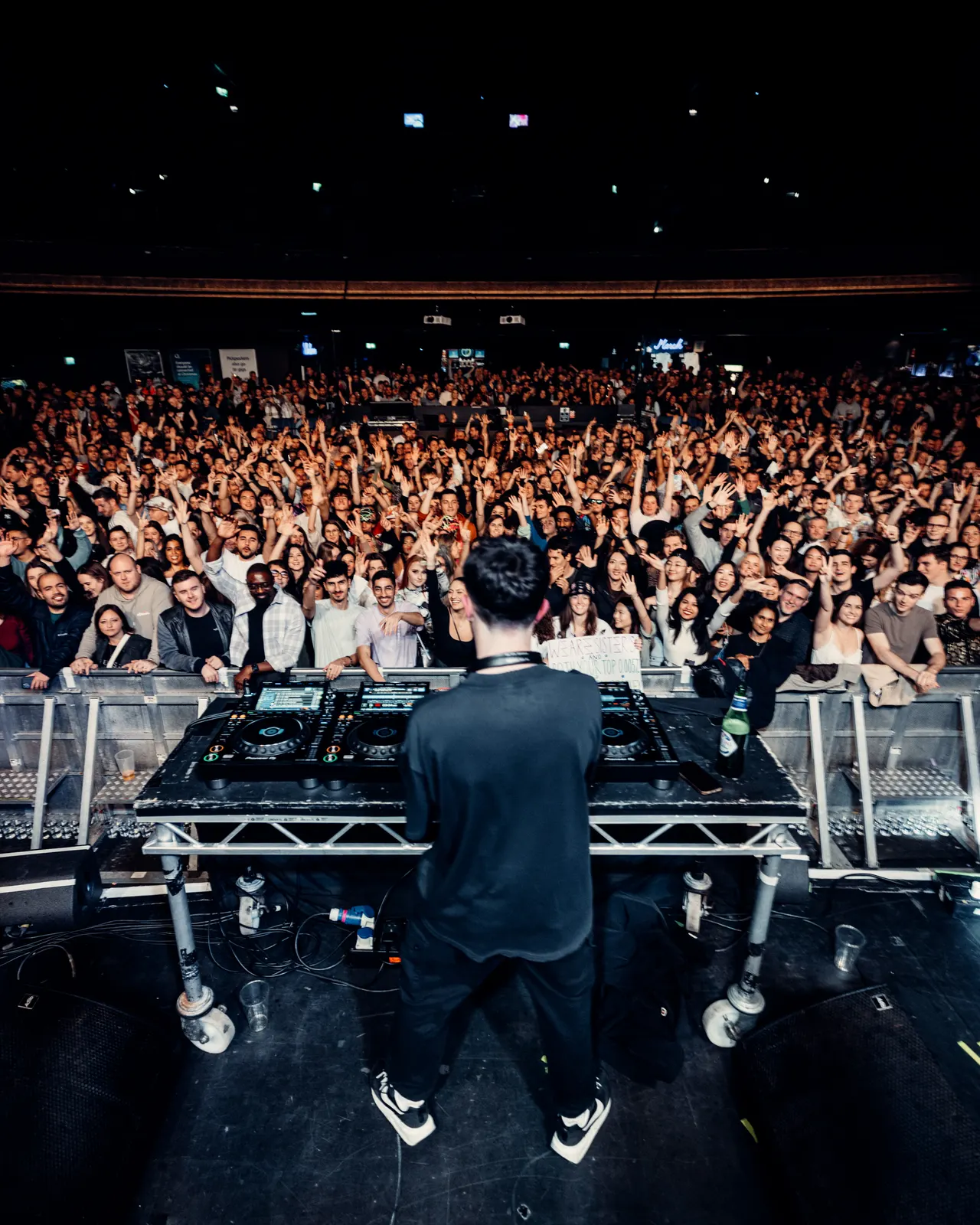 SUBSHIFT facing a crowd from the DJ booth